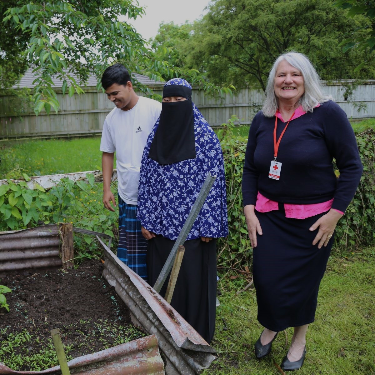 Refugee support volunteer, Rose Osborne with Ahsan Ullah, Sabekum Nahar.