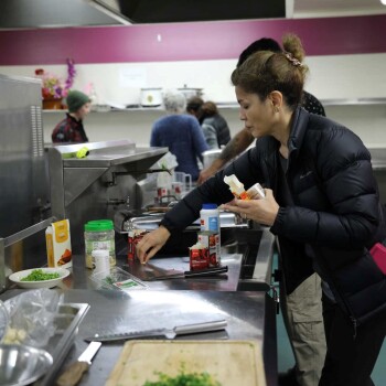 Two people cooking meals