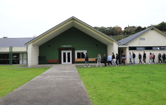 People entering Araiteuru Marae in Ōtepoti Dunedin