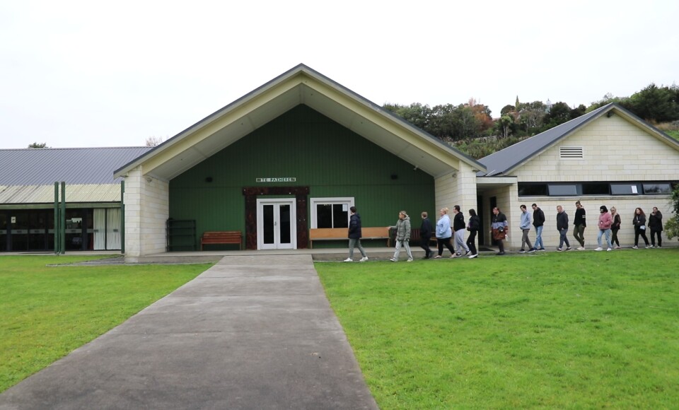 People entering Araiteuru Marae in Ōtepoti Dunedin