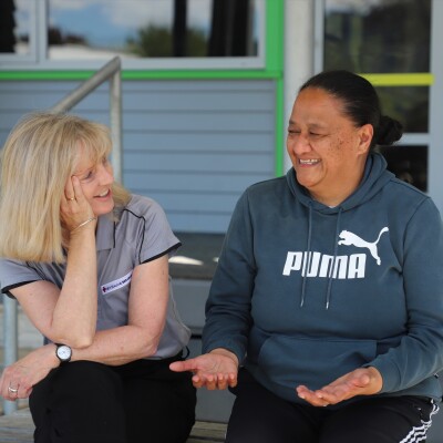 Two women talking to each other