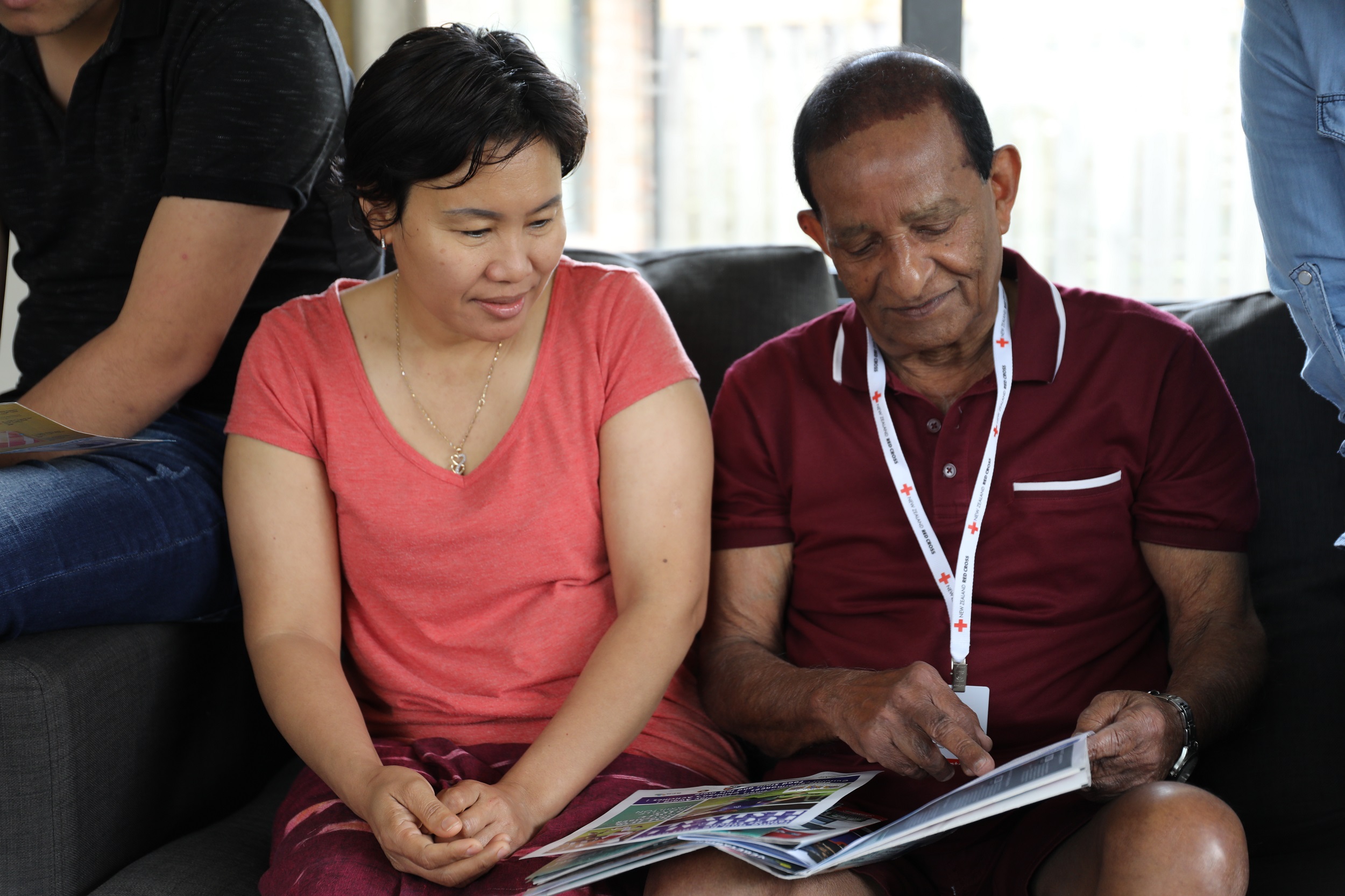 A man and woman sitting next to each other.