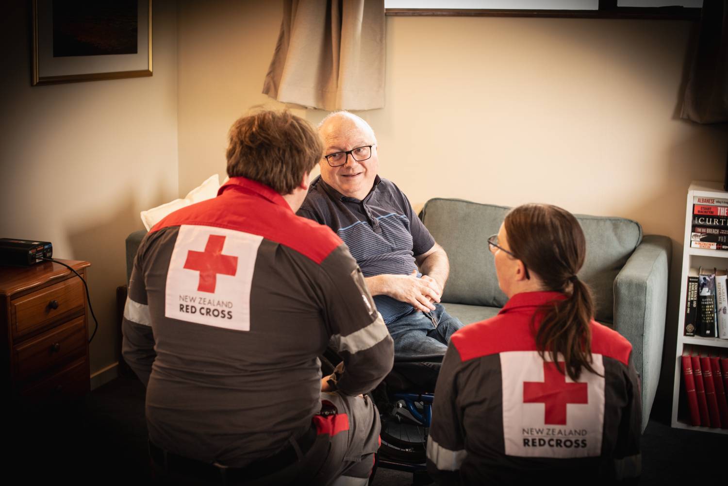 Chris Ford with Dunedin Disaster Welfare and Support Team members Josh and Linda, reflecting on his flooding experience last year