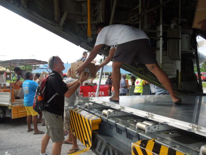 International Delegate unloads supplies